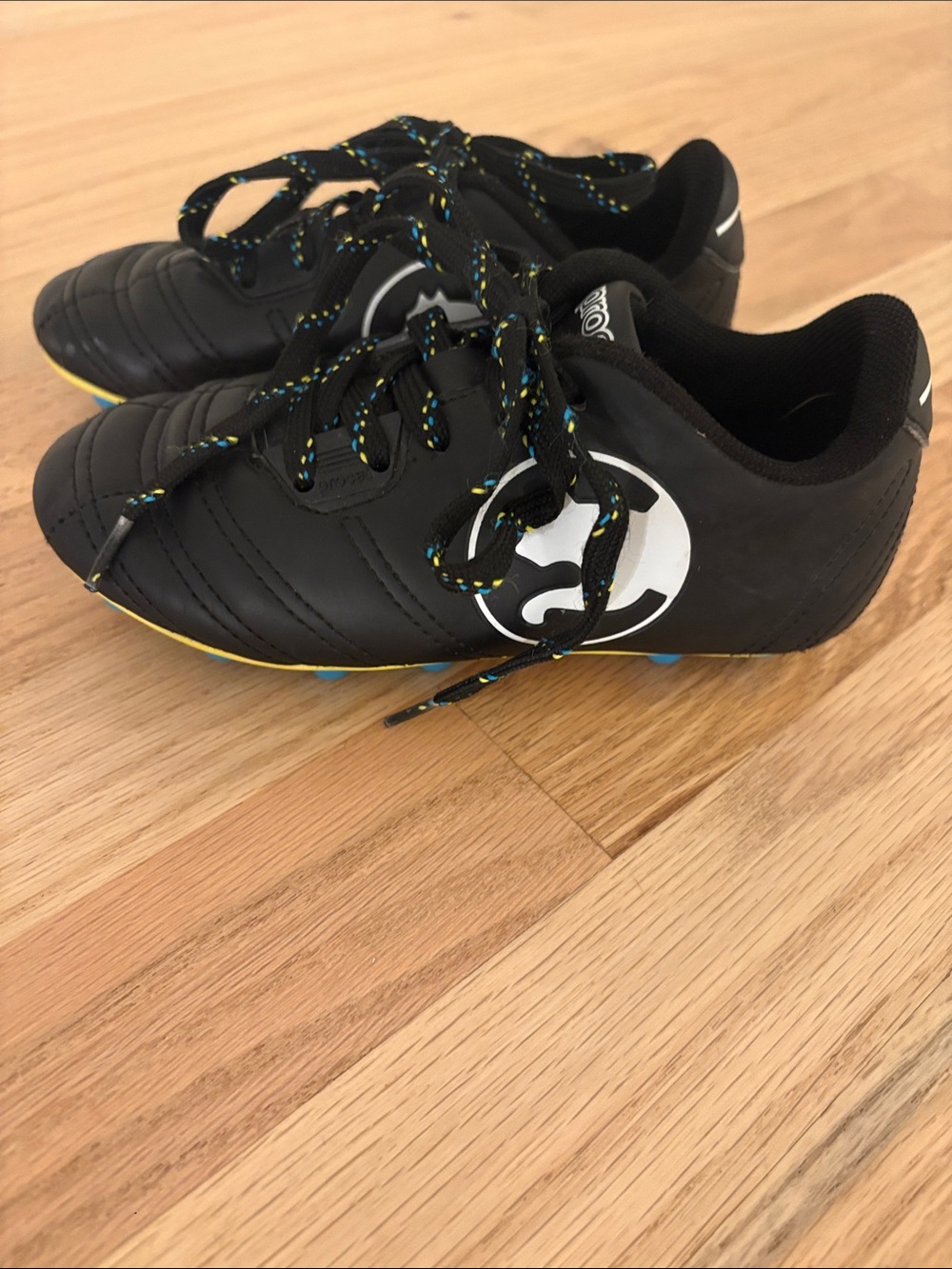 Puma Kids Black Soccer Cleats with Yellow Details
